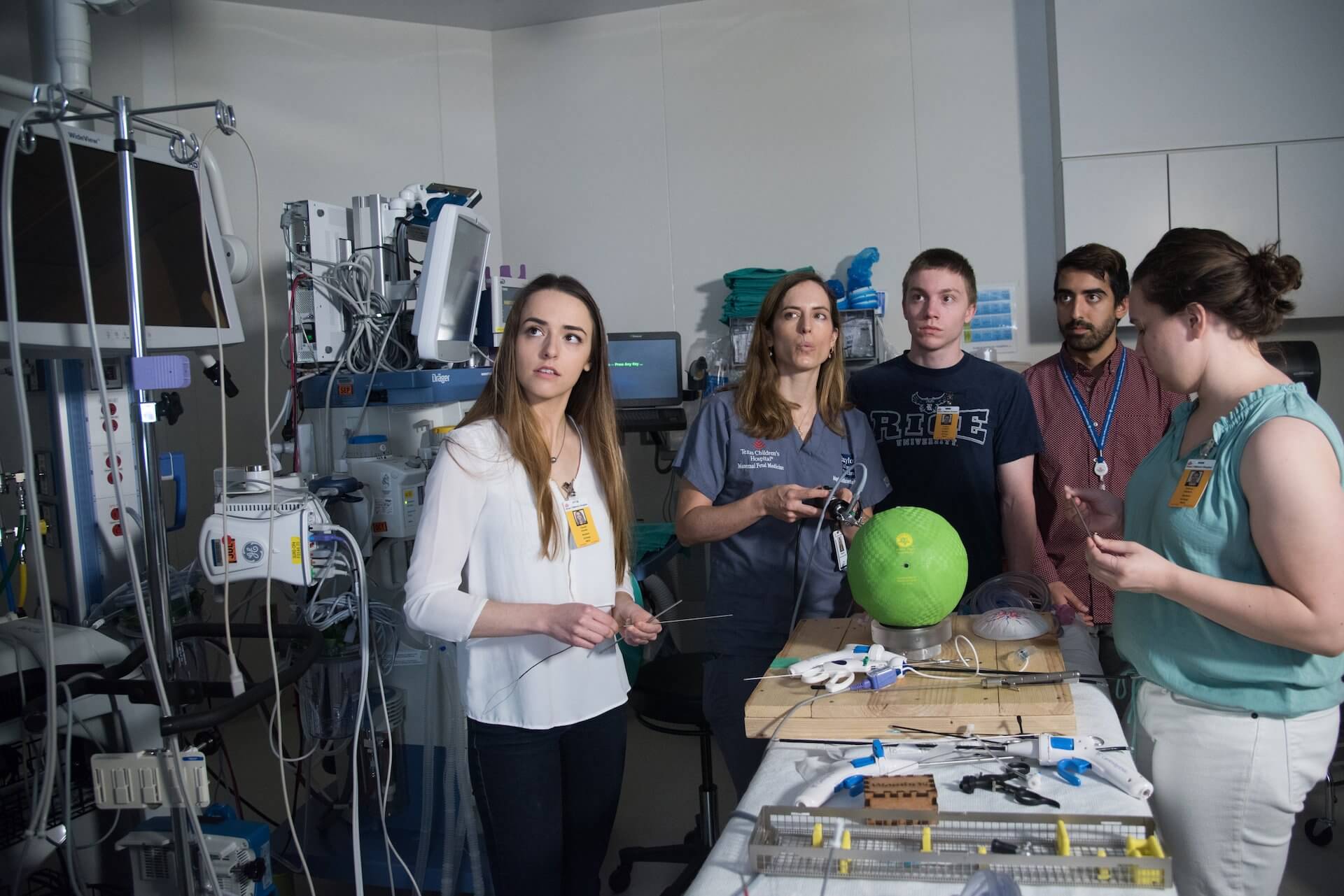 Rice students and their adviser, Dr. Magdalena Sanz Cortes, watch a monitor as their endoscopic pulse oximeter is put through its paces at Texas Children's Hospital. From left: Claudia Iriondo, Sanz Cortes, Thomas Loughlin, Samir Saidi and Kathryn Wallace. (Credit: Jeff Fitlow)