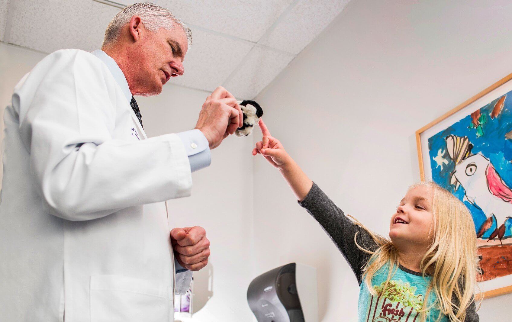 Angus Wilfong, M.D., evaluates patient Scarlett for the Epidiolex trial (credit: Allen Kramer/Texas Children’s Hospital)