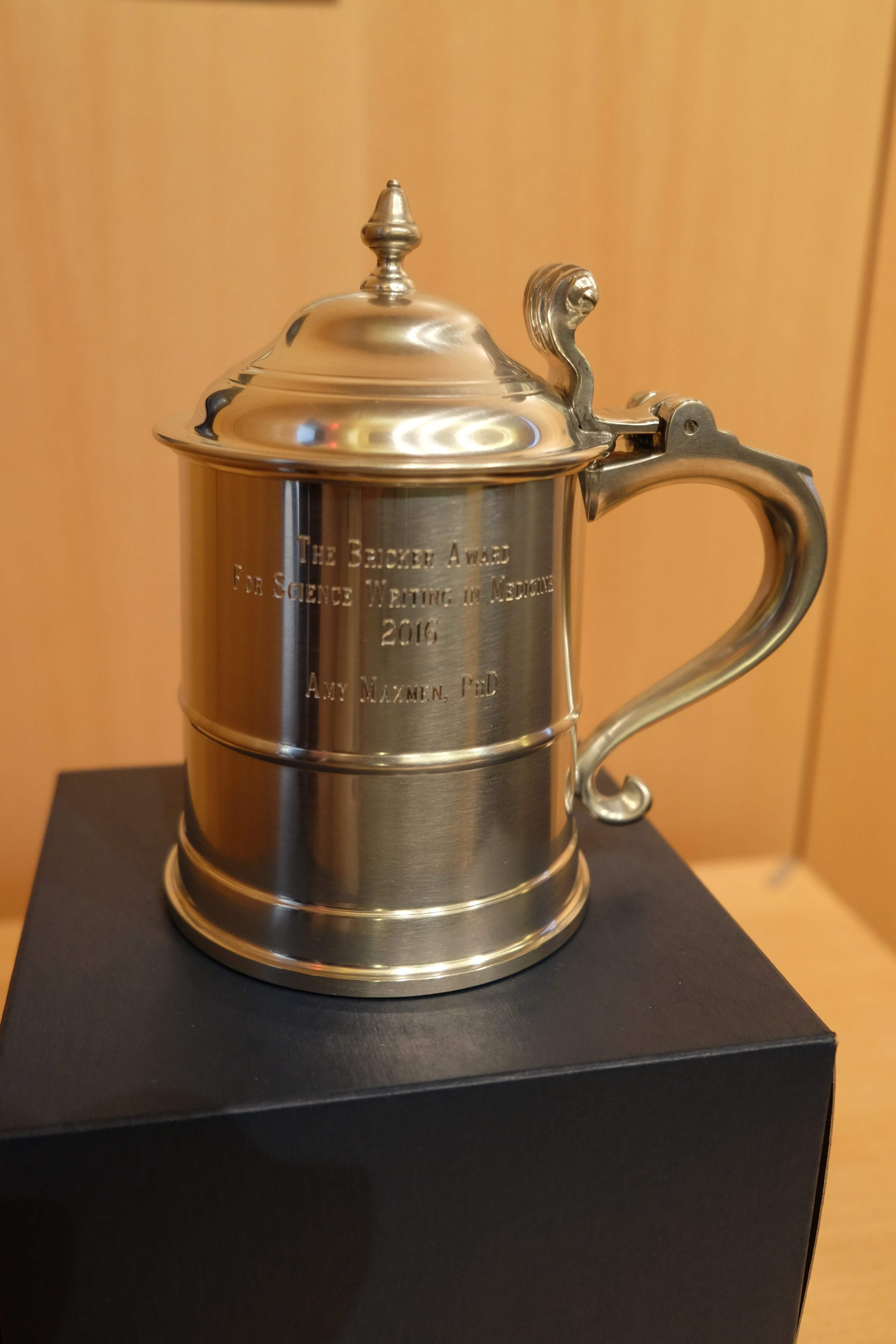 The award is an engraved, silver-plated beer stein—an homage to David Bricker’s self-proclaimed passion for craft beer, and surely one of the science writing profession’s most unique awards. (Photo credit: Doris Huang, Houston Methodist)
