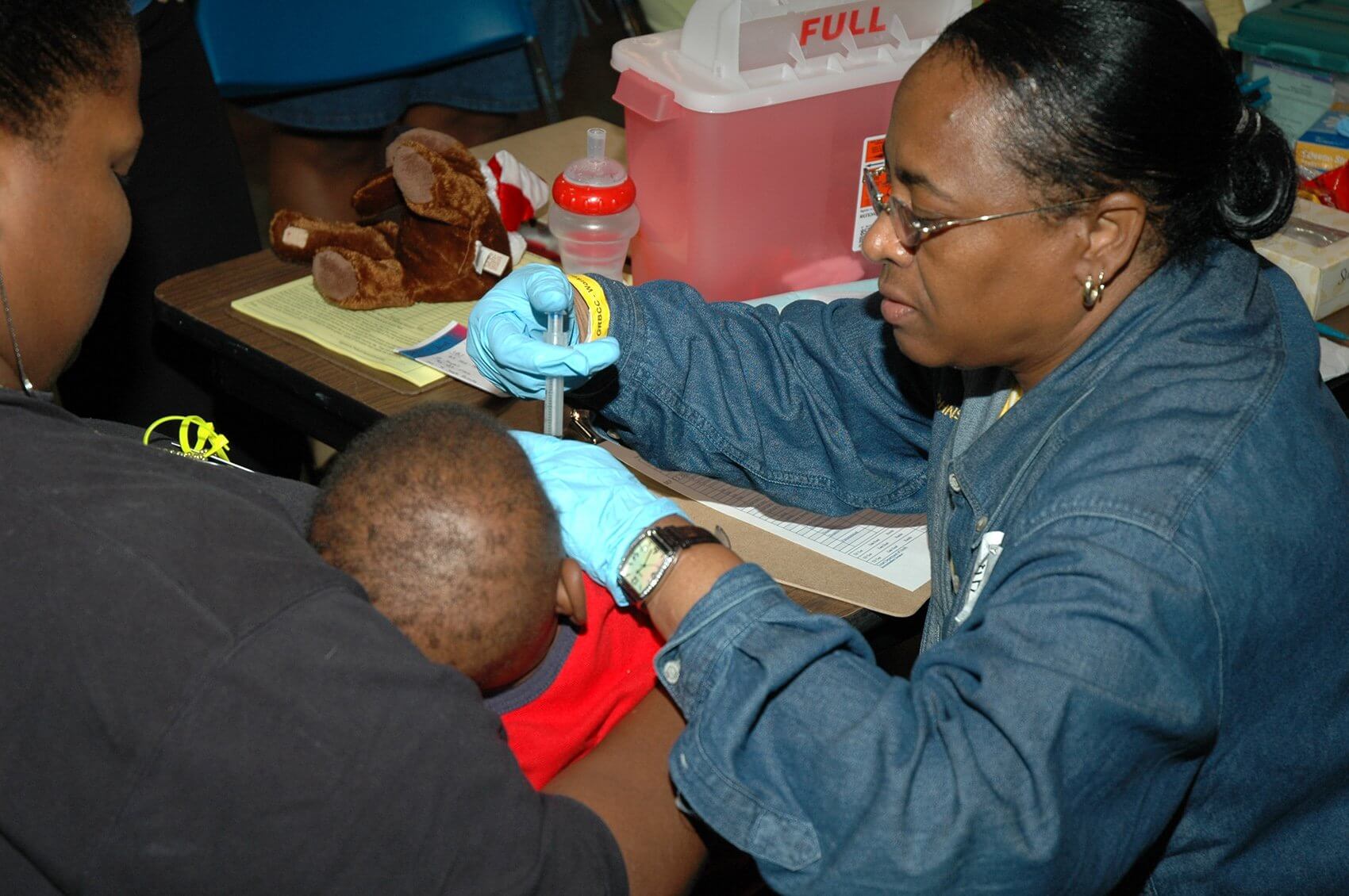Treating a young Hurricane Katrina survivor. (Photo courtesy The University of Texas Health Science Center at Houston)