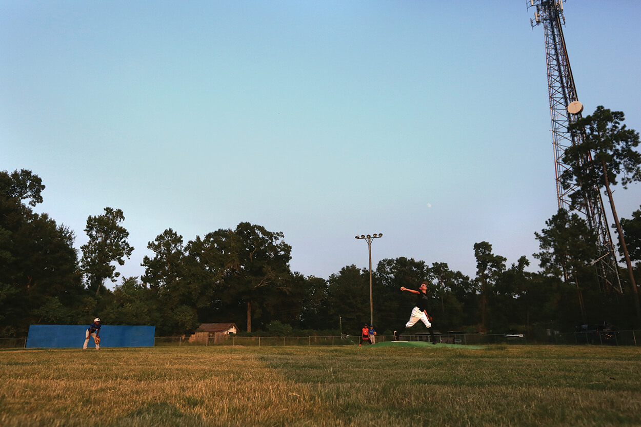 Ethan Page delivers a pitch during baseball practice at The Zone in Kingwood, Texas.