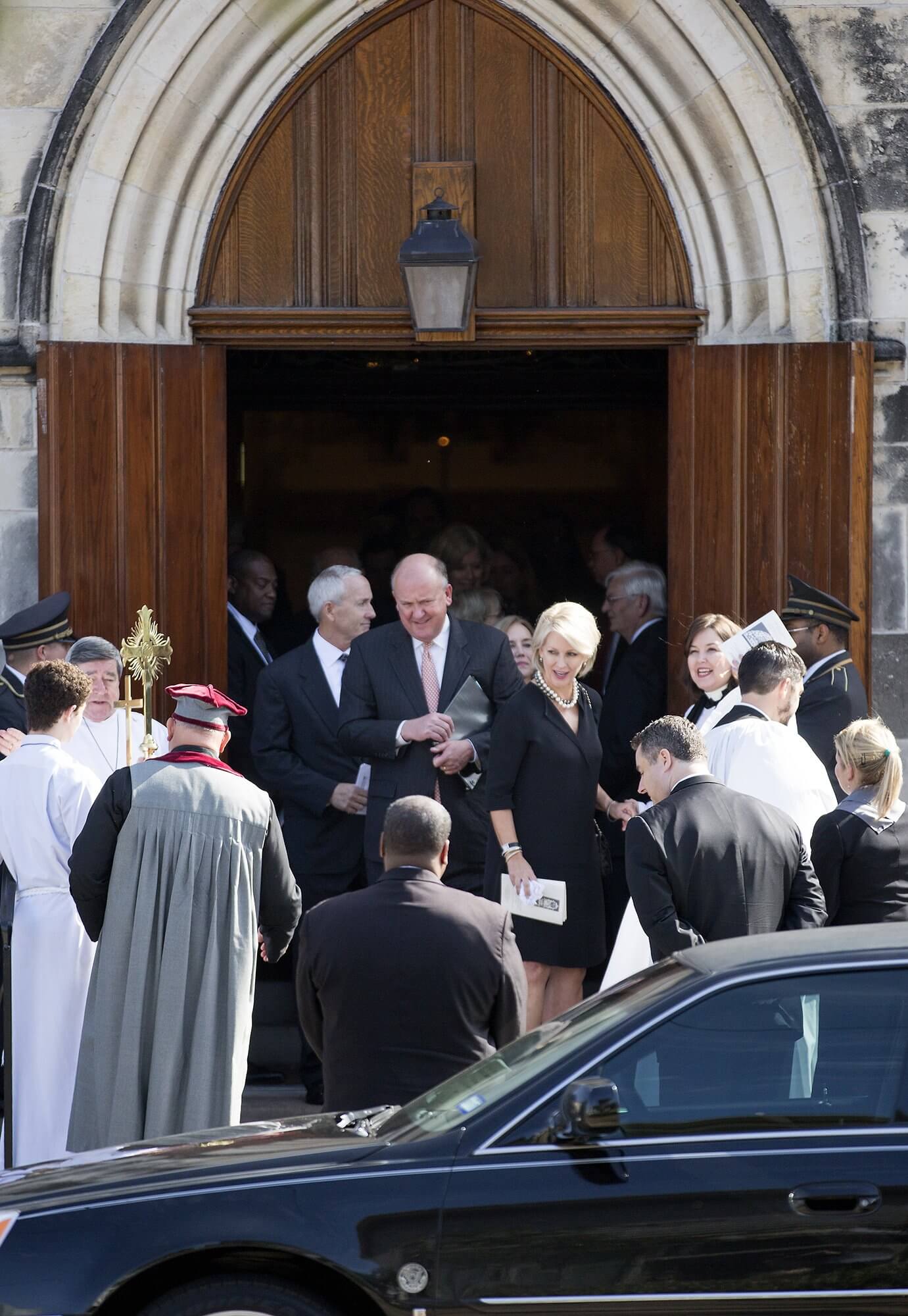 Charles “Chuck” Fraser, M.D., and wife Helen Cooley Fraser, son-in-law and daughter of Dr. Cooley, respectively, leave Trinity Episcopal Church after the memorial service on Nov. 28, 2016. (Photo: Cody Duty)