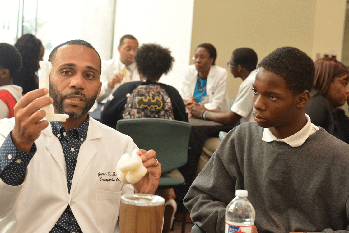 MD Anderson orthopedic oncologist Justin E. Bird, M.D., demonstrated how joints work during the 100 Black Men of Metropolitan Houston's 
