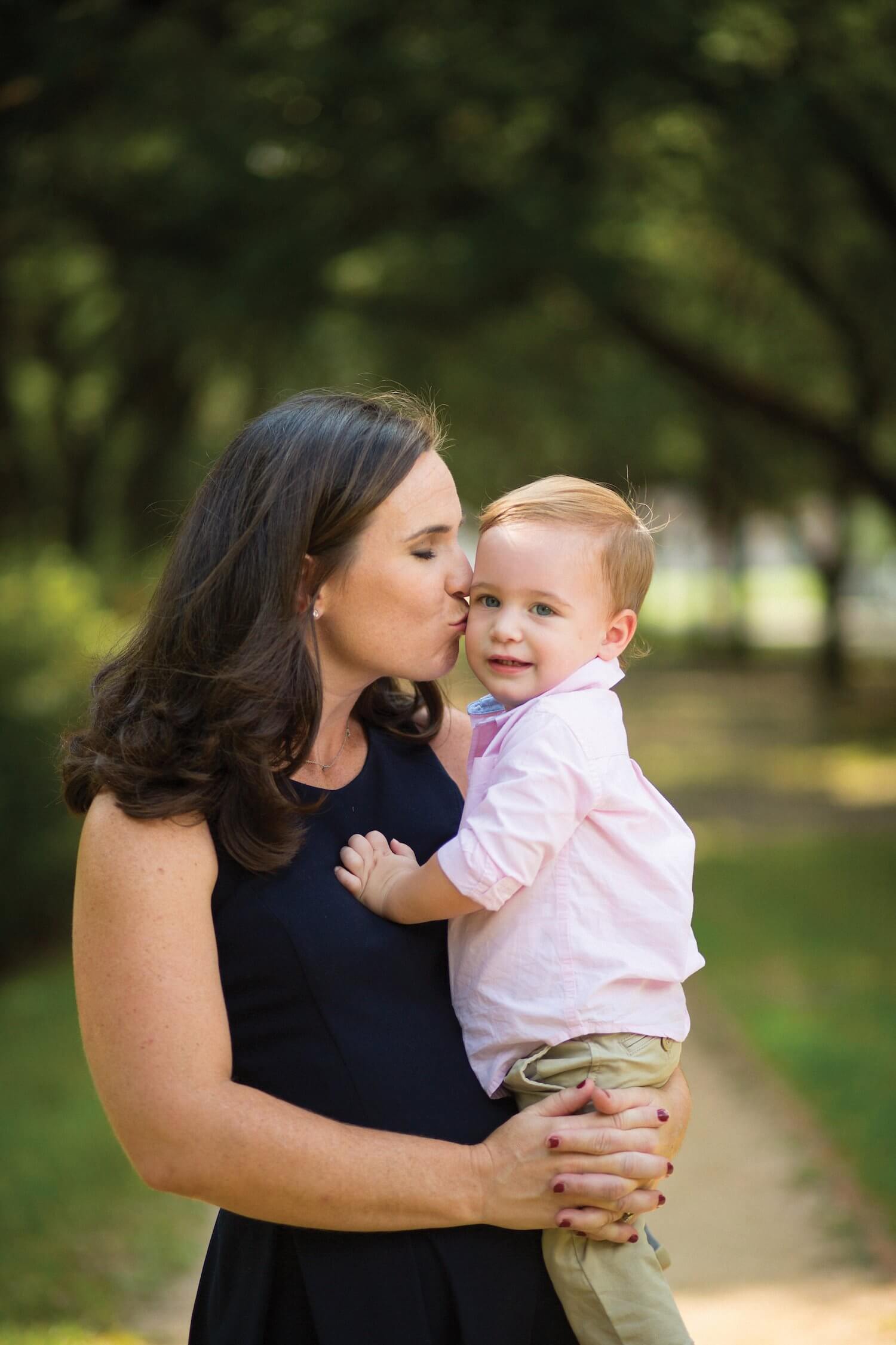 Molly Hackett LaFauci plants a kiss on her youngest child, J.J.