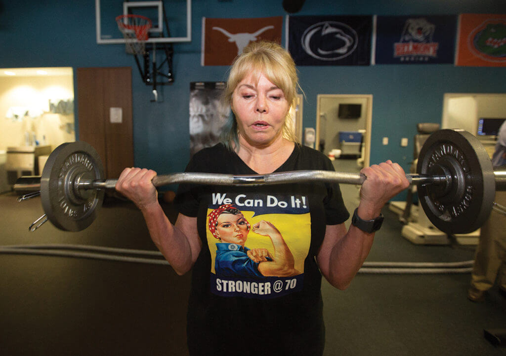 Jean Hoepfel, 70, performs bicep curls at the Memorial Hermann IRONMAN Sports Medicine Institute’s Human Performance Lab.