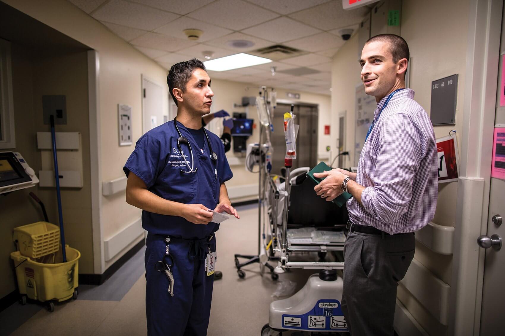 Farzad Soleimani, M.D., associate director of TMC Biodesign and assistant professor of emergency medicine at Baylor College of Medicine, confers with digital health fellow Dave Morris.
