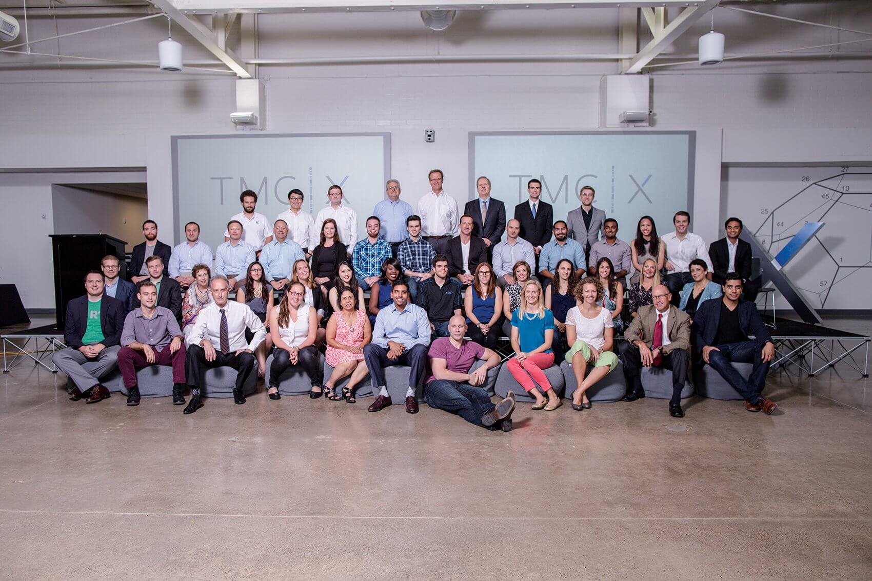 For the first class of TMCx, composed of 21 companies from all across the globe and pictured here alongside TMCx staff, their efforts to refine their businesses and showcase their solutions all came together on Demo Day.