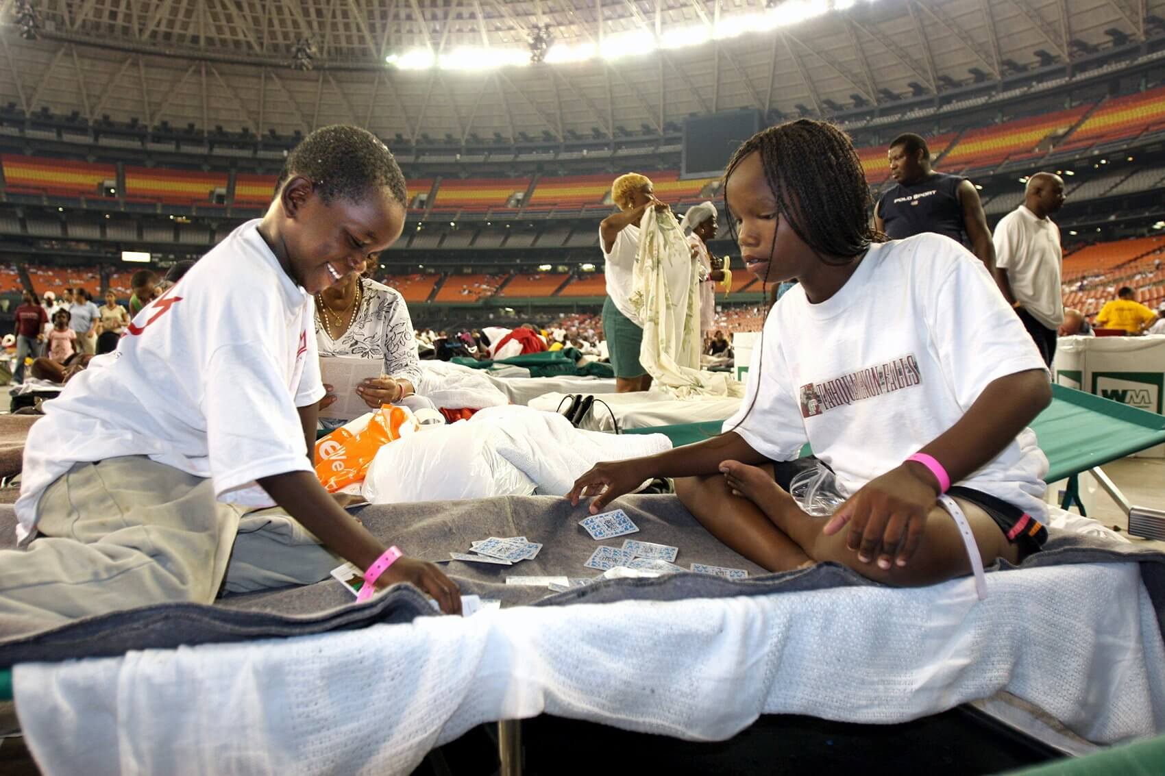Hurricane Katrina survivors pass the time at the Astrodome. (Photo courtesy Texas Children's Hospital)