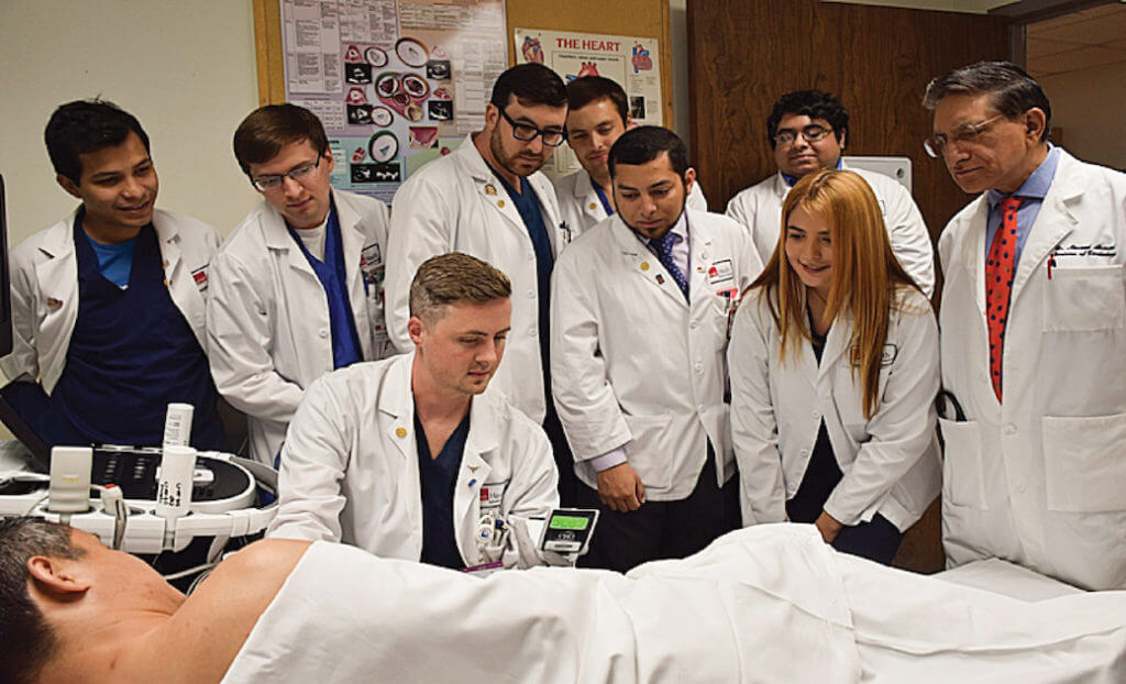 UTMB students practice with handheld ultrasound device