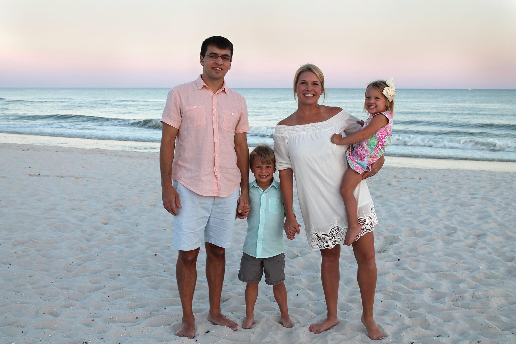 A beach portrait of Robert Aertker, M.D., and his family.