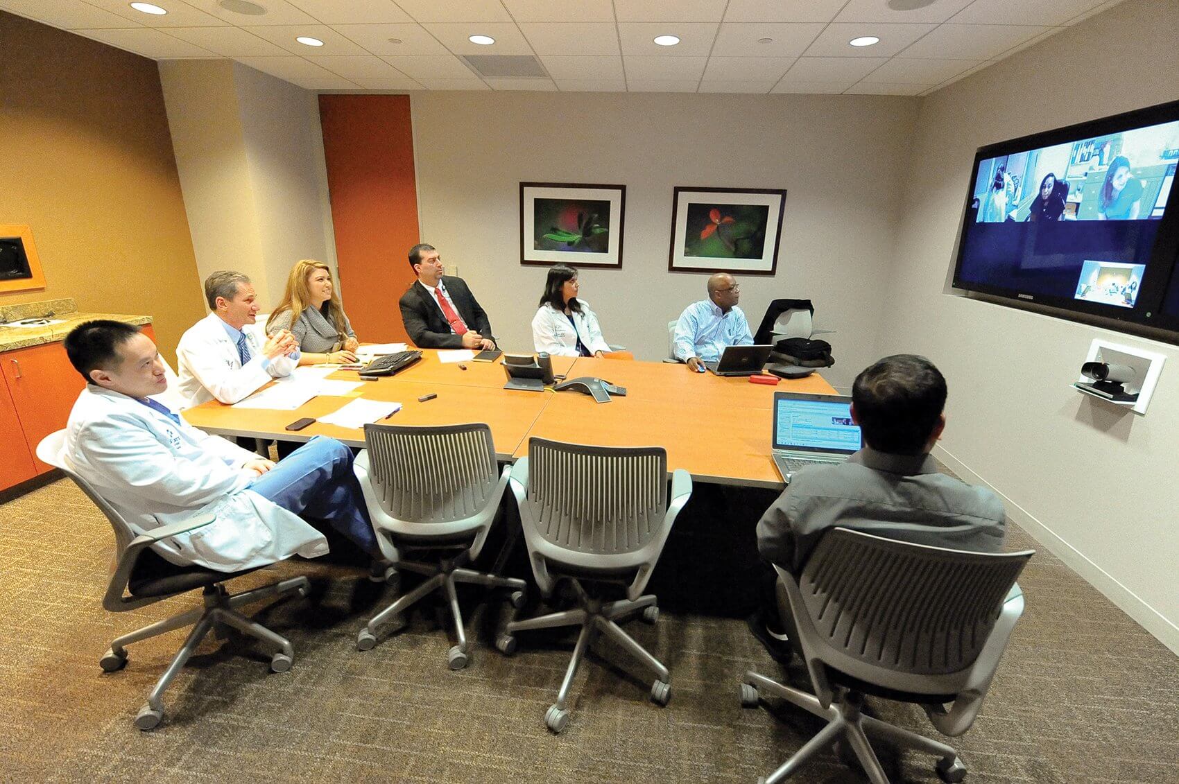 Project ECHO physicians sit in a conference room at Baylor St. Luke’s, consulting with community providers over teleconference. (Credit: Baylor St. Luke’s)