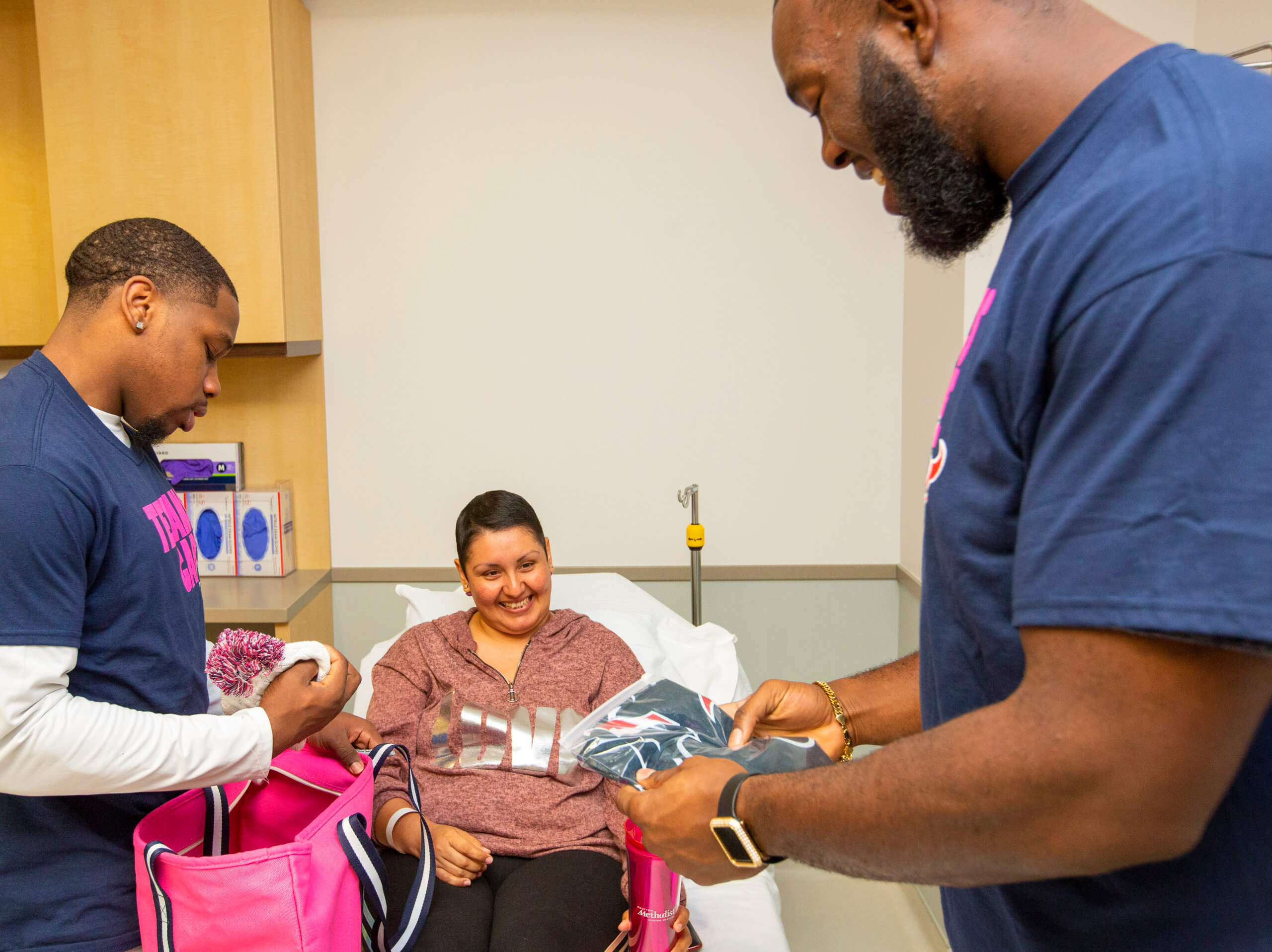 Each breast cancer patient received pink Houston Texans bags filled with team gear.
