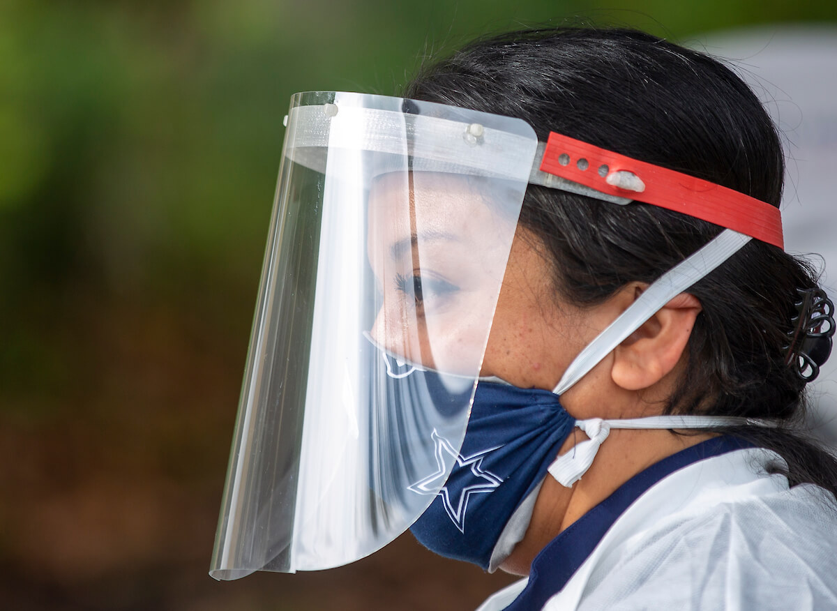 Health workers wore face masks and shields.
