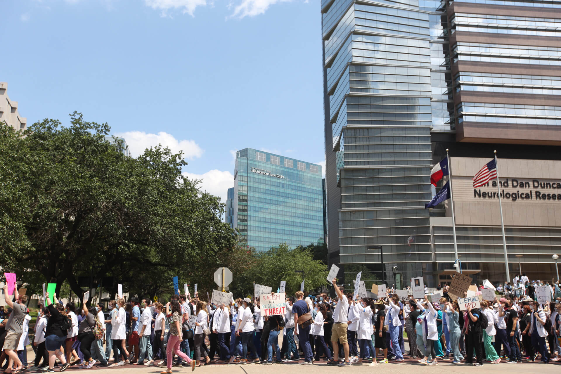 Texas Medical Center health professionals participate in a walking vigil for black lives on Tuesday, June 9, 2020.